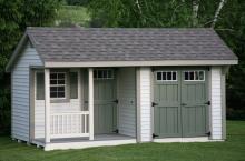 Deluxe Quaker 10′ x 16′ • Heritage grey vinyl siding, clay trim, avocado green doors and shutters, slate architectural shingles Options • Shutters, transom windows, gable vents, corner porch, single entrance door