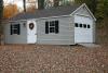 Cape Cod Garage 14′ x 24′ Clay vinyl siding, white trim and doors, black shutters, bark architectural shingles